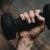 a person's hand holding a dumbbell